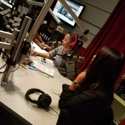 Dr. Angela during a media interview at a radio station