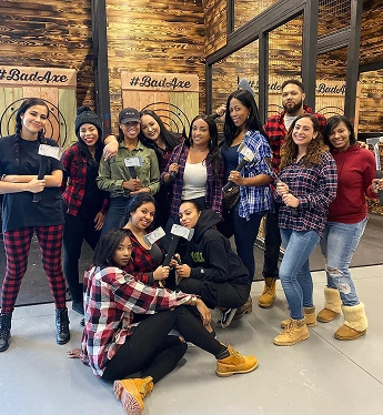 Pediatric dental team members posing together during a holiday celebration