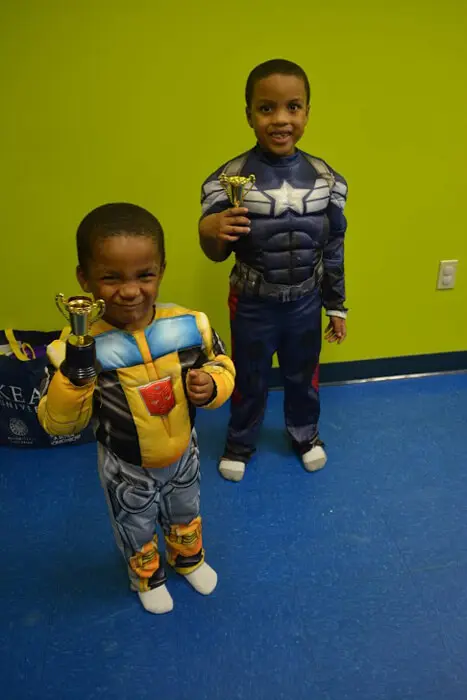Children in superhero costumes at the Alexandria Children's Dentistry Halloween Party