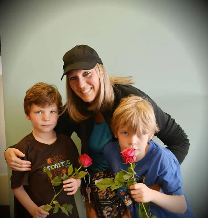 Children holding Mother's Day roses received at Alexandria Children's Dentistry