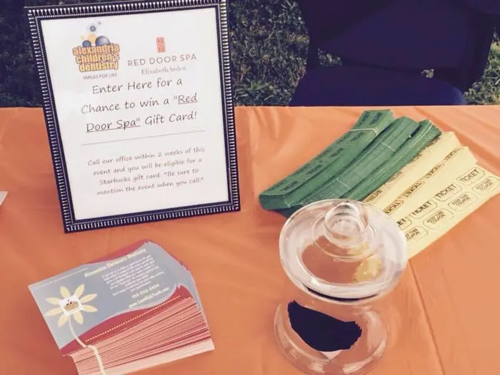 Alexandria Children's Dentistry giveaway sign and raffle prizes at Oktober Fest 2014