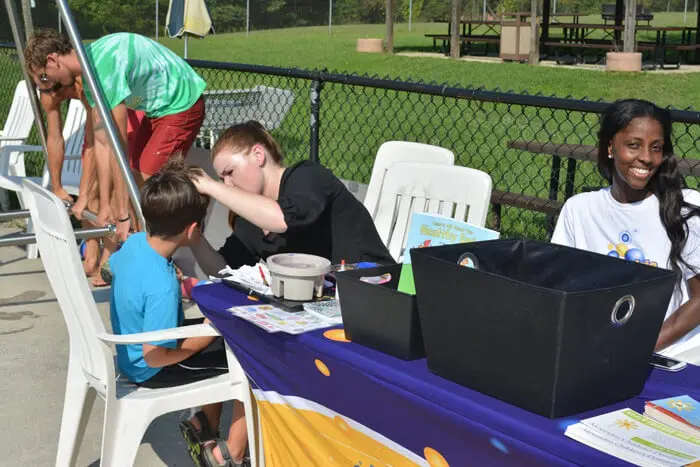 Alexandria Children's Dentistry staff interacting with visitors during the Ft. Belvoir Pooch Plunge