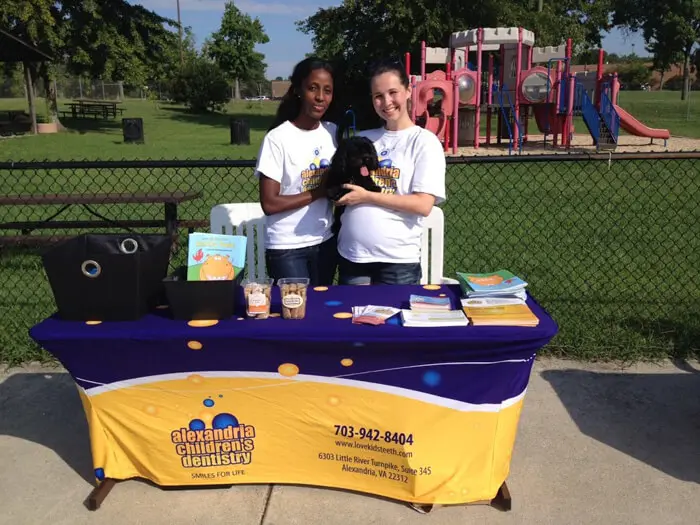 Alexandria Children's Dentistry team welcoming families at the Ft. Belvoir Pooch Plunge