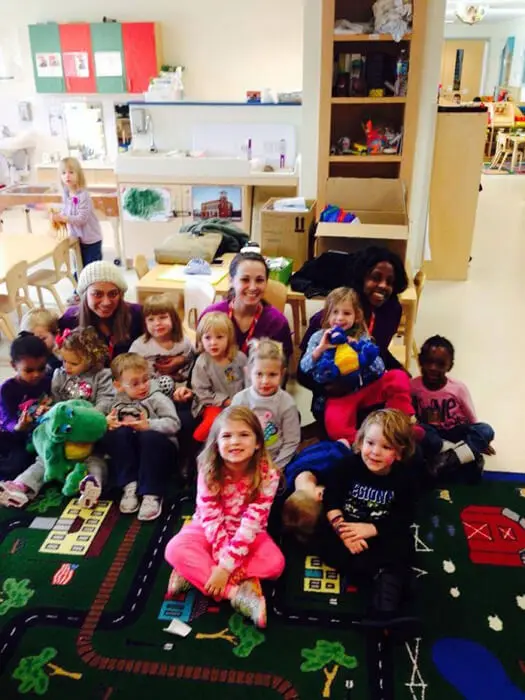 Preschool class posing with the Alexandria Children's Dentistry team after a dental education visit