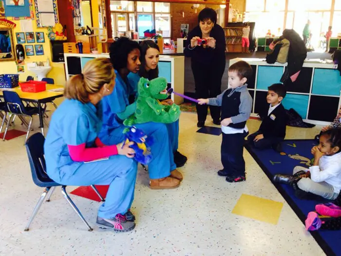 Alexandria Children's Dentistry presenting oral hygiene education to young students