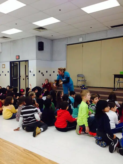 Students attending an Alexandria Children's Dentistry school presentation on oral hygiene
