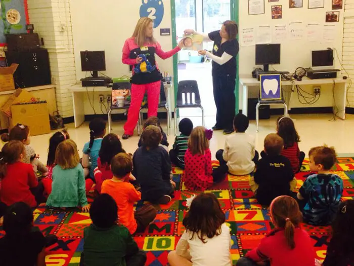 Alexandria Children's Dentistry presenting a school assembly on healthy teeth and brushing habits