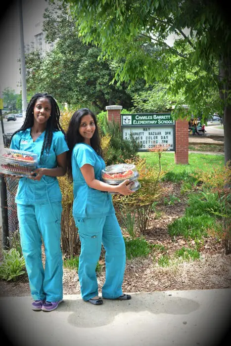 Alexandria Children's Dentistry team delivering Mother's Day gifts to a local school