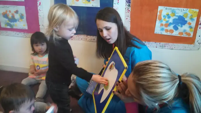 Child learning about brushing with Alexandria Children's Dentistry educator